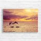 Dolphins Leaping at Sunset Canvas Print