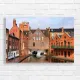 Urban Canal View Brick Building Canvas Print